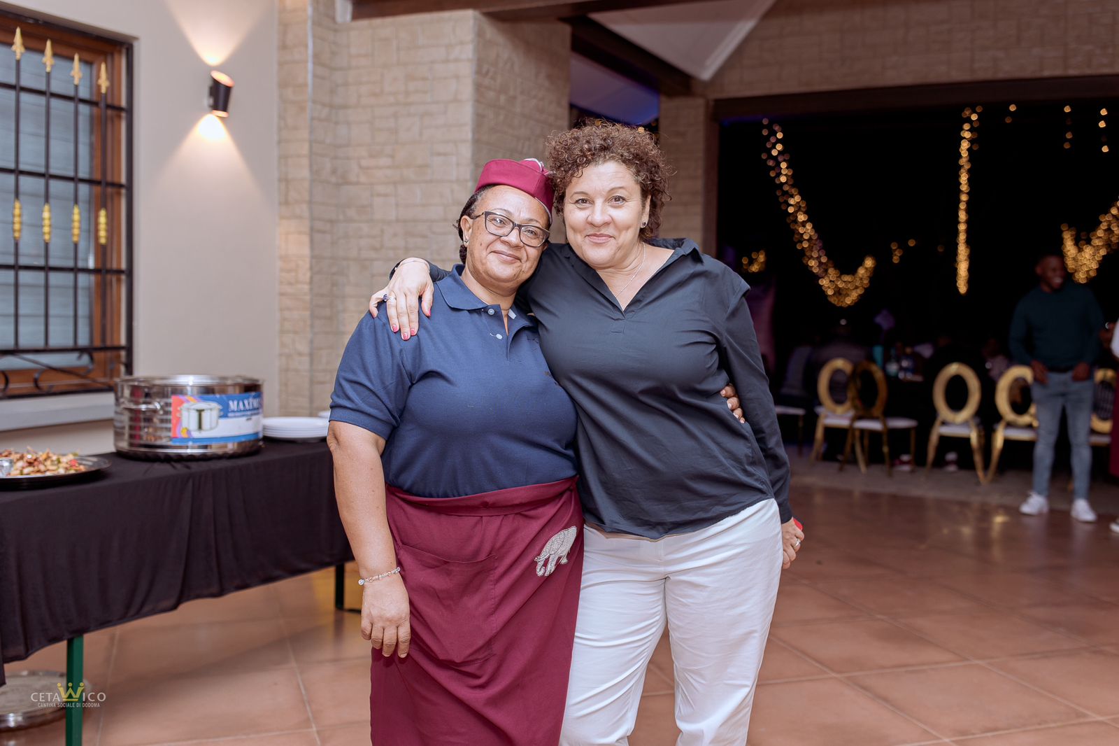 The JVC Catering team preparing and serving Tanzanian dishes at a catered event